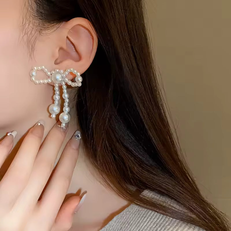 Pendientes de mujer de nuevo estilo, tendencia de moda, nudo de lazo de perla de imitación, temperamento elegante, pendientes bonitos para chica, regalo de vestir exquisito