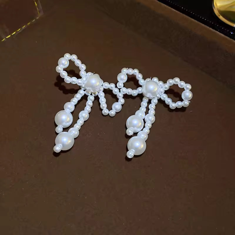Pendientes de mujer de nuevo estilo, tendencia de moda, nudo de lazo de perla de imitación, temperamento elegante, pendientes bonitos para chica, regalo de vestir exquisito