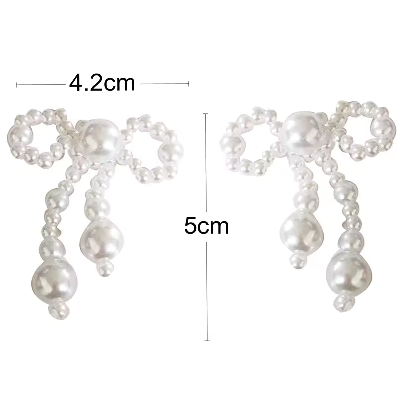 Pendientes de mujer de nuevo estilo, tendencia de moda, nudo de lazo de perla de imitación, temperamento elegante, pendientes bonitos para chica, regalo de vestir exquisito