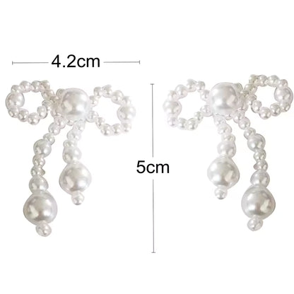 Pendientes de mujer de nuevo estilo, tendencia de moda, nudo de lazo de perla de imitación, temperamento elegante, pendientes bonitos para chica, regalo de vestir exquisito