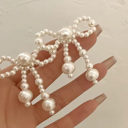 Pendientes de mujer de nuevo estilo, tendencia de moda, nudo de lazo de perla de imitación, temperamento elegante, pendientes bonitos para chica, regalo de vestir exquisito