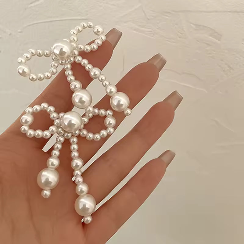 Pendientes de mujer de nuevo estilo, tendencia de moda, nudo de lazo de perla de imitación, temperamento elegante, pendientes bonitos para chica, regalo de vestir exquisito